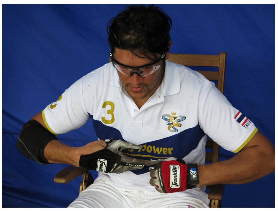 Polo player adjusting gear